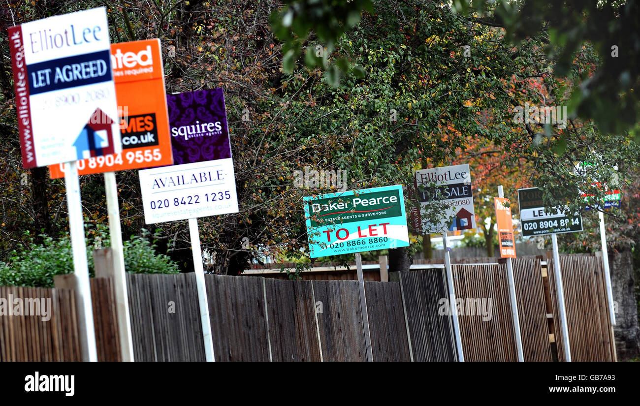To let and for sale property boards on Watford Road in Sudbury, London. The annual rate at which house prices in England and Wales are falling nearly doubled during September to hit a record of 8%, figures showed today. Stock Photo