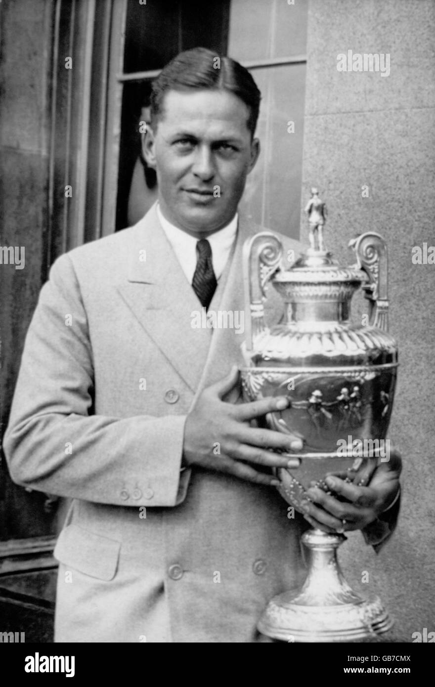 Golf. Bobby Jones poses with a trophy, the result of yet another tournament victory for the American Stock Photo