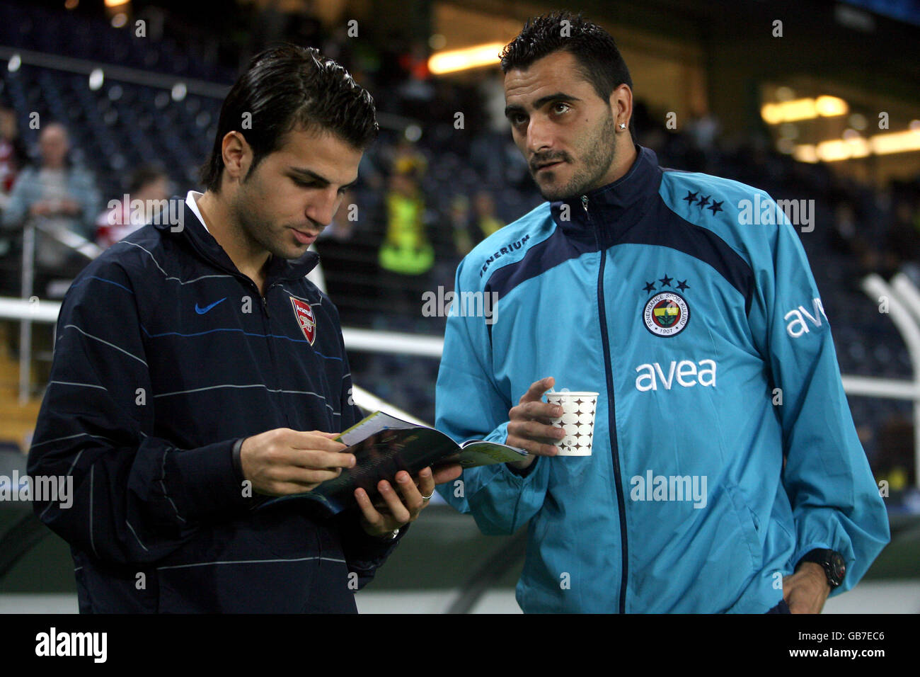 Fenerbahce's Daniel Guiza and Arsenal's Francesc Fabregas talk before the game Stock Photo