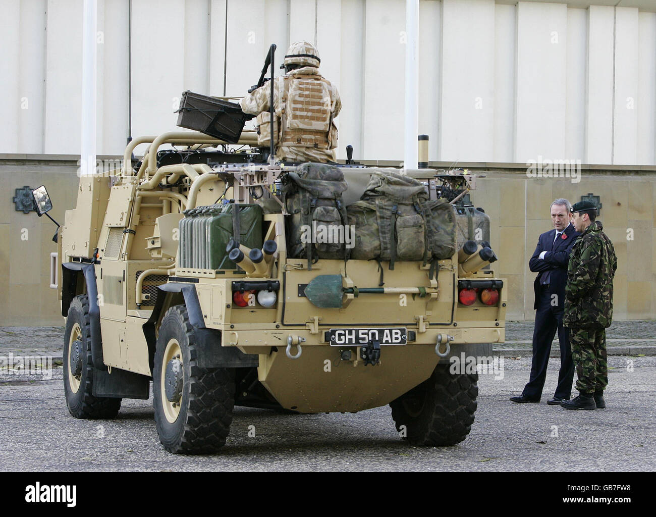 Defence Secretary John Hutton views the army's Jackal armoured vehicle