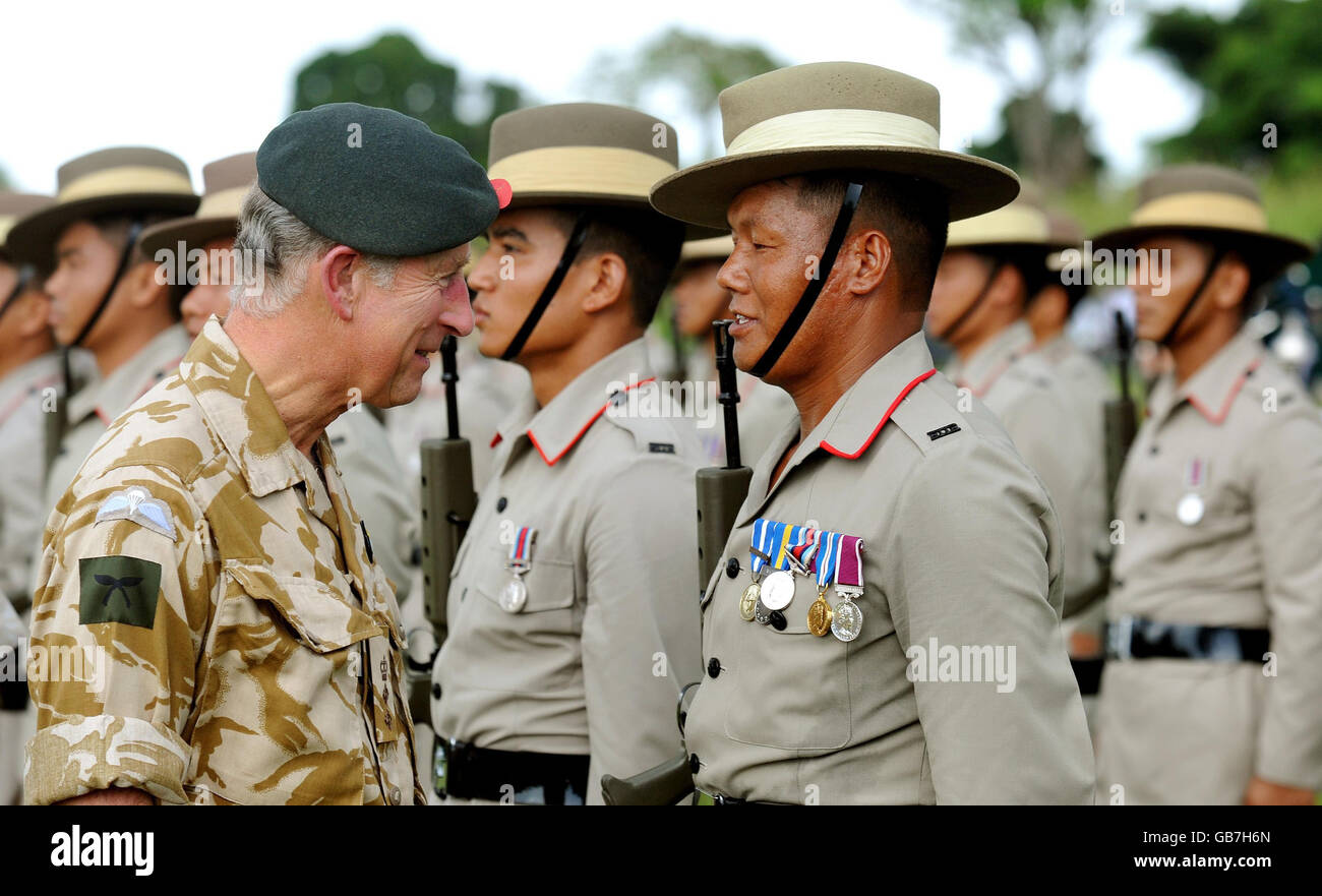 The Prince of Wales talks to a Gurkha soldier in the guard of honour, after arriving at the Gurkha ceremony at the Seria Garrison in Brunei, south east Asia. Stock Photo