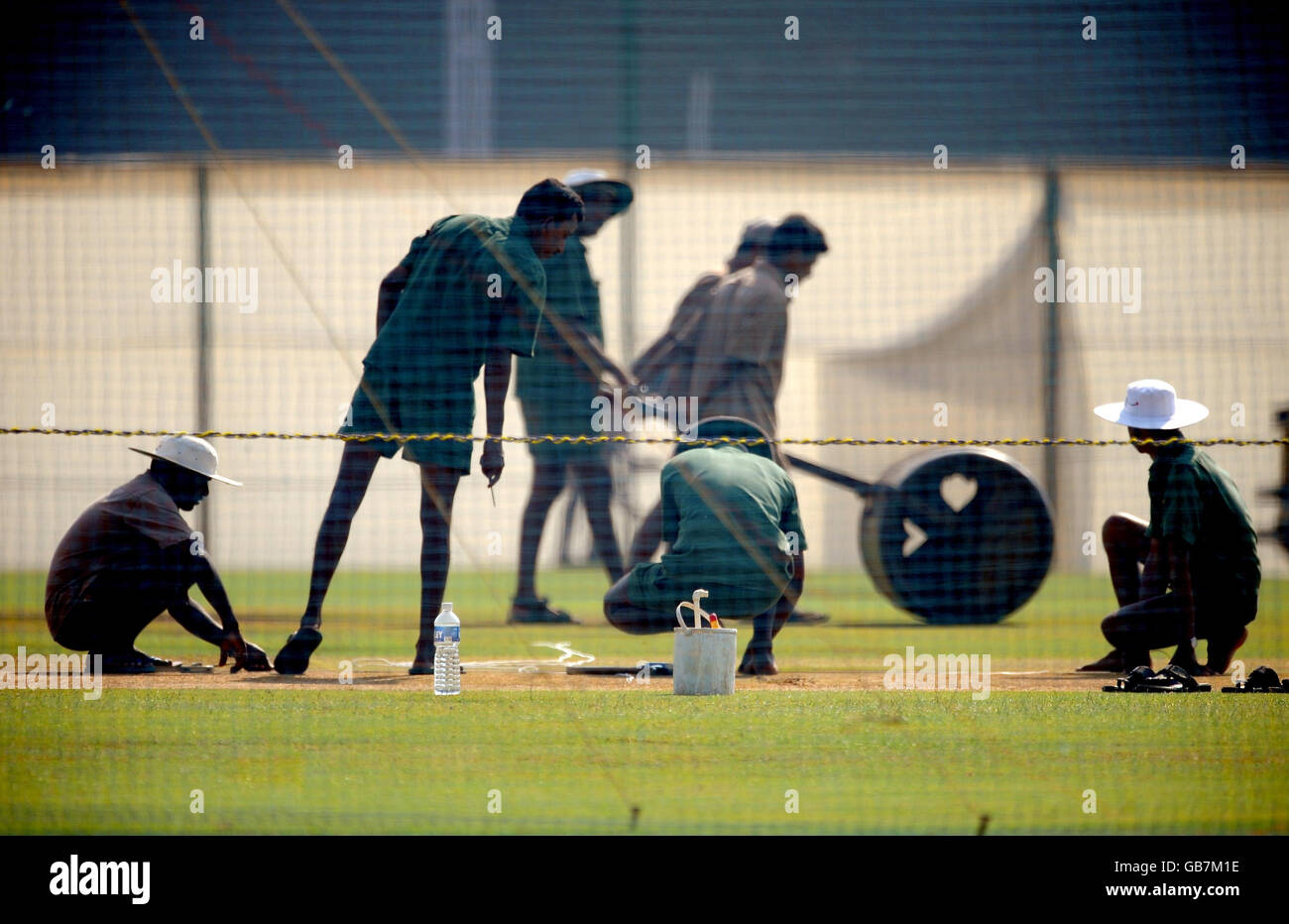 Cricket - Nets Session - Brabourne Stadium - Mumbai. Groundsmen prepare the wicket for tomorrow's warm up game at the Brabourne Stadium, Mumbai, India. Stock Photo