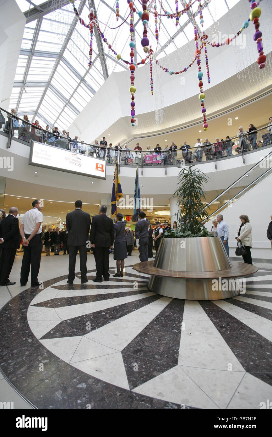 Shoppers and staff members stop to observe the National Armistice Day of two minutes silence at Lakeside Shopping Centre in Thurrock, Essex. Stock Photo