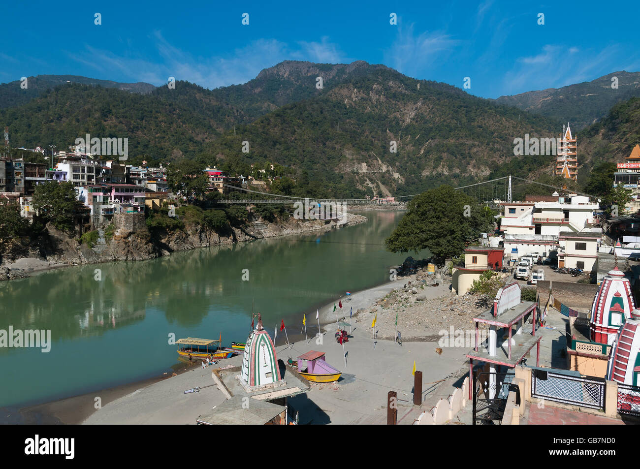 Laxman Jhula bridge over Ganges river.  Rishikesh is  World Capital of Yoga Stock Photo