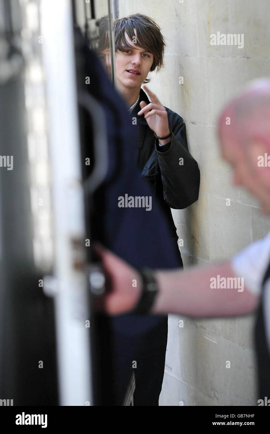 Tara Ferry, 18, looks on after his brother Otis Ferry enters a police van. Otis Ferry, 25, had his counsel withdraw a bail application today at Gloucester Crown Court. Stock Photo