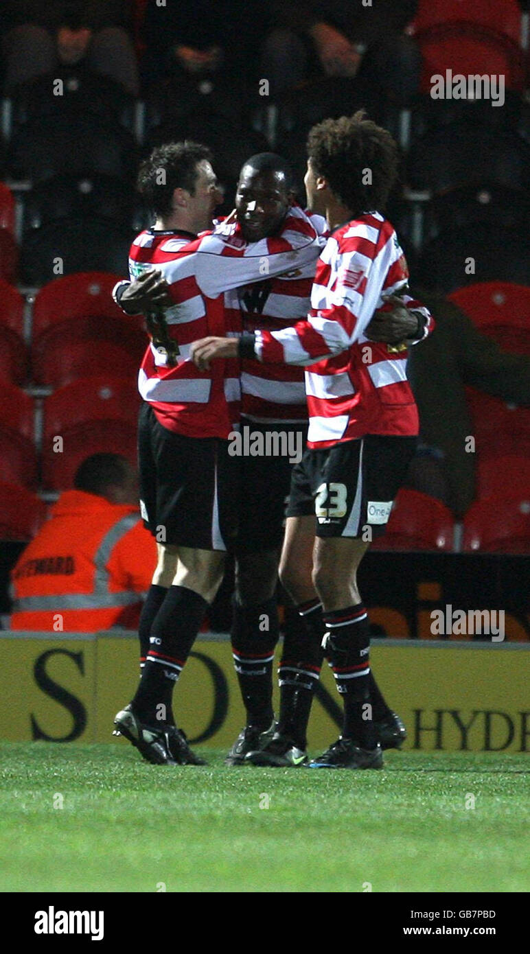Doncaster Rovers' Shelton Martis is congratulated on scoring Doncaster's first goal during the Coca-Cola Football Championship match at Keepmoat Stadium, Doncaster. Stock Photo
