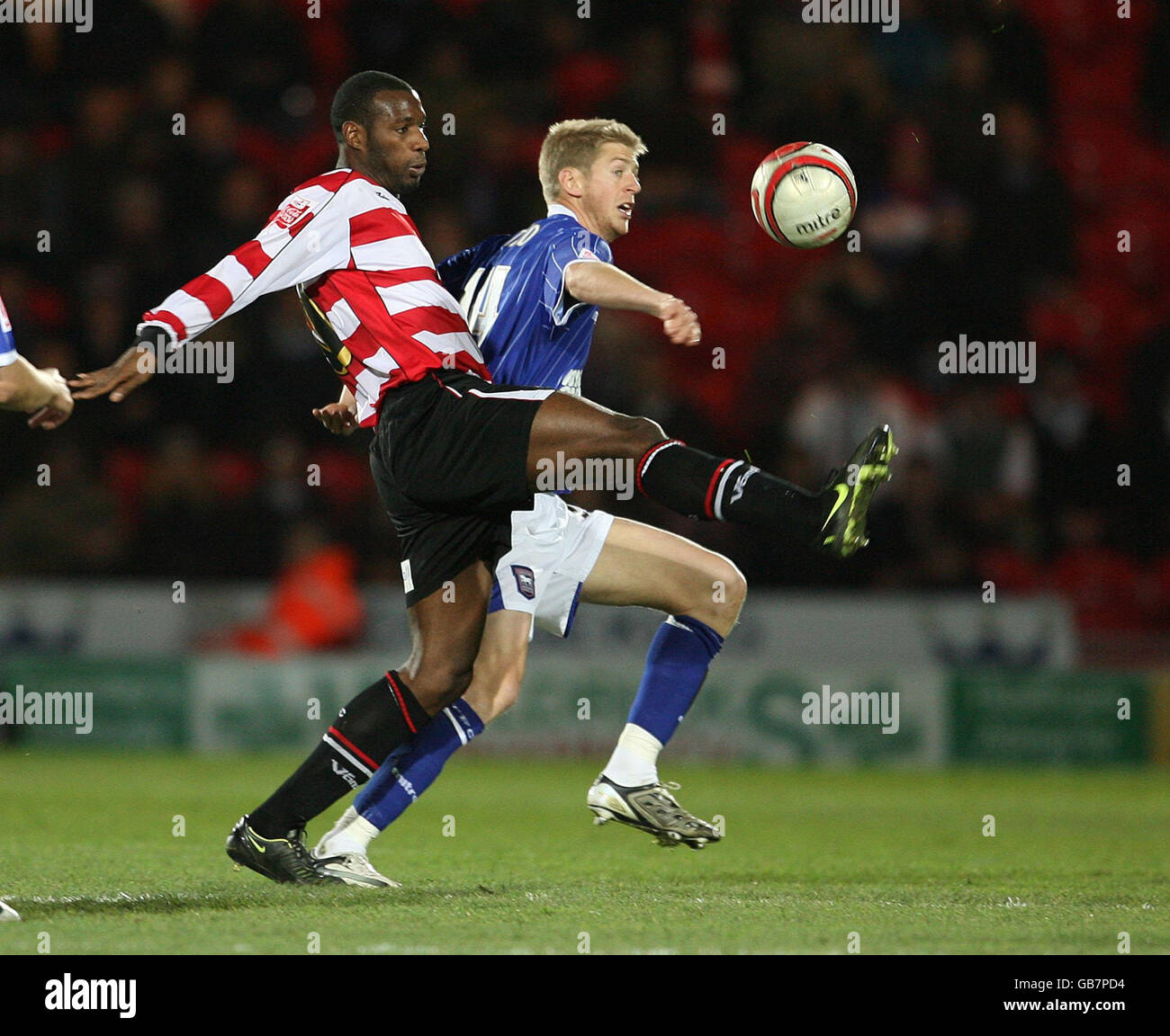 Doncaster Rovers' Shelton Martis and Ipswich Town's Jonathan Stead battle for the ball during the Coca-Cola Football Championship match at Keepmoat Stadium, Doncaster. Stock Photo