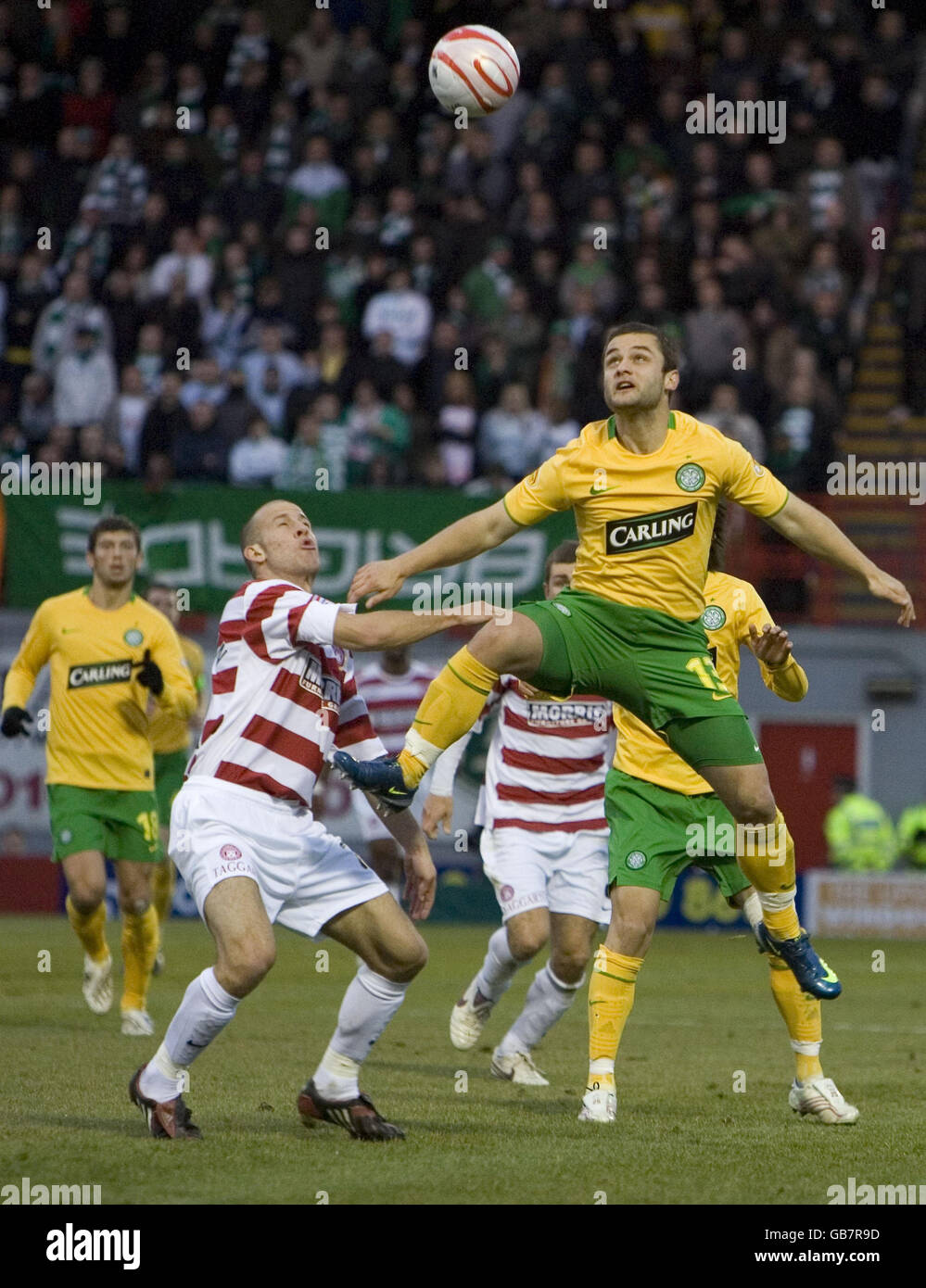 Celtic striker Shaun Maloney leaps above Hamilton defender Trent