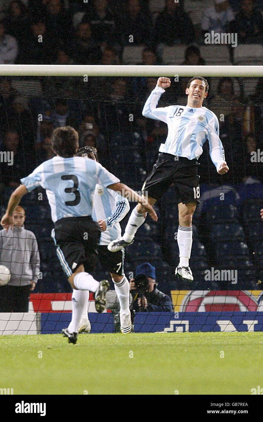 Soccer - International Friendly - Scotland v Argentina - Hampden Park. Argentina's Maximiliano Rodriguez (in air) celebrates after scoring his sides opening goal Stock Photo