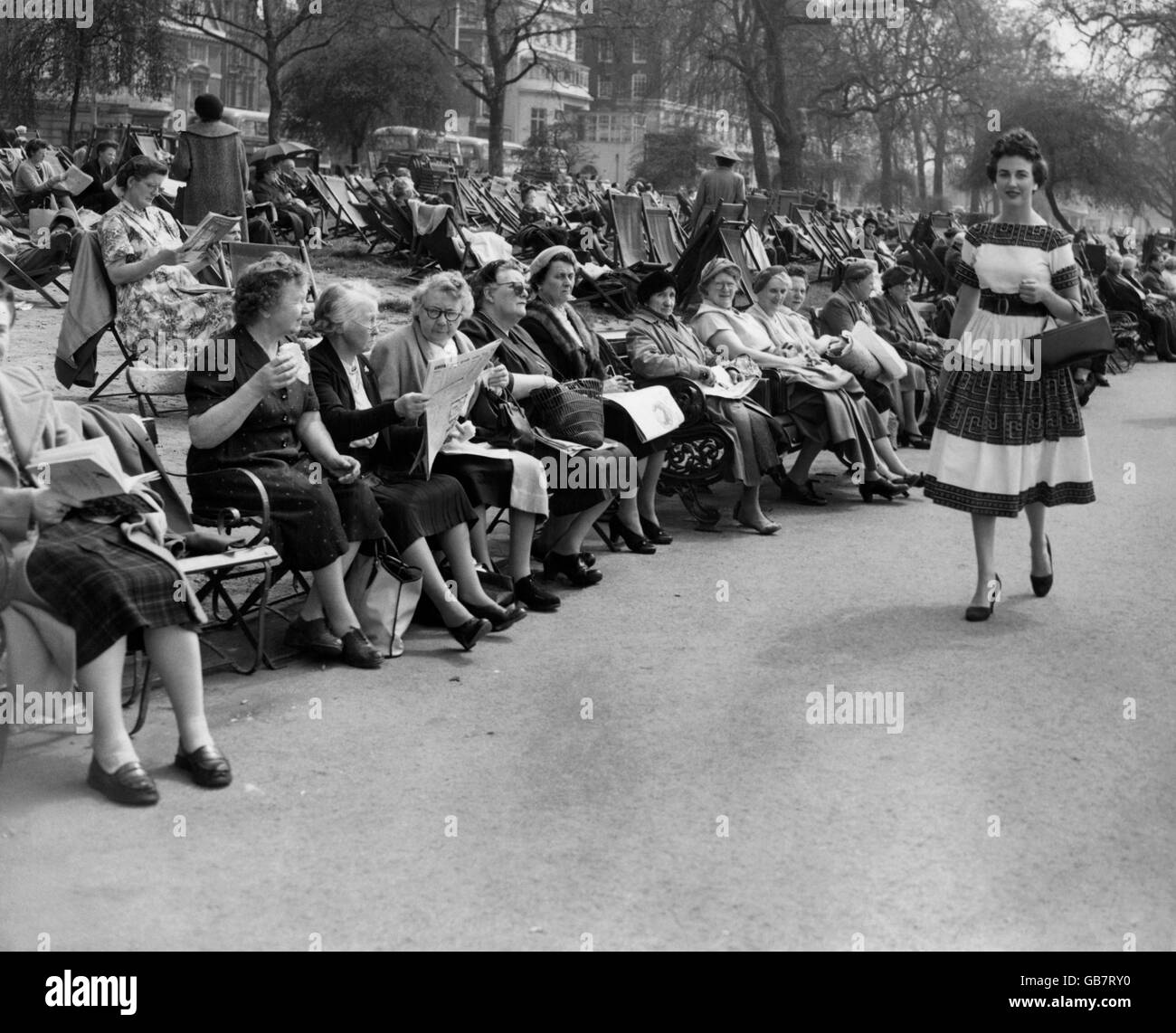 Women enjoying a spring heat wave in Hyde Park, London. Stock Photo