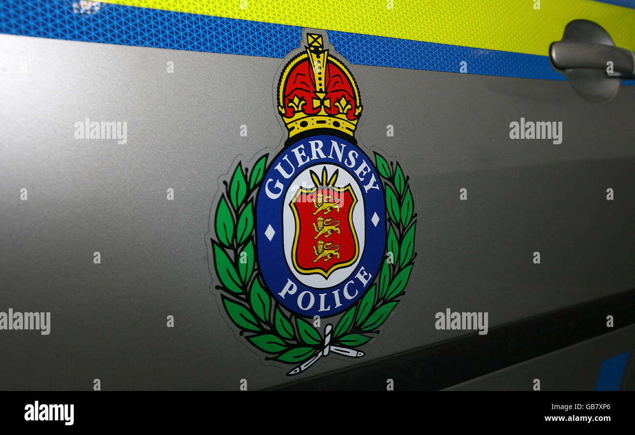 A guernsey police logo on a police car hires stock photography and