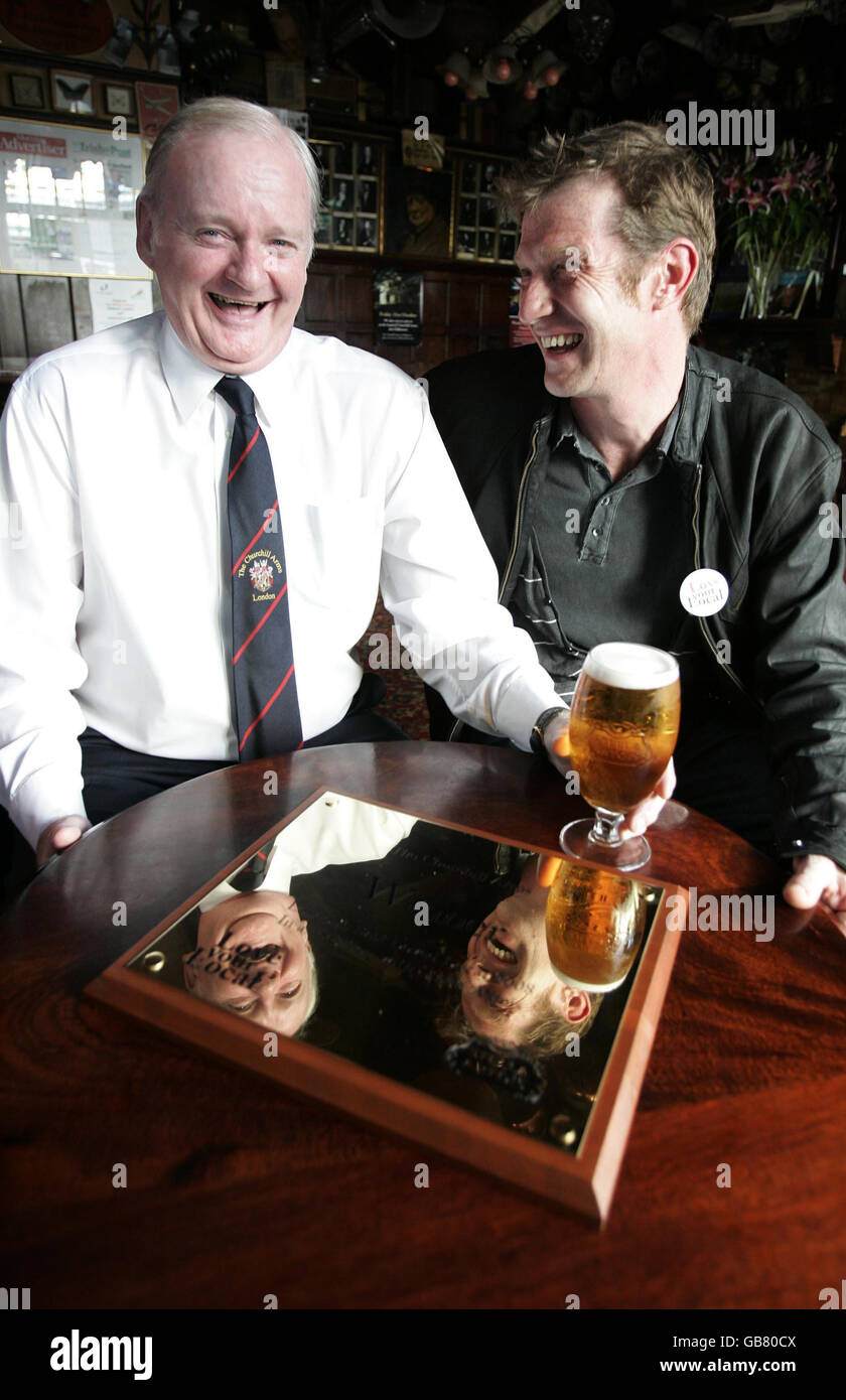 Landlord Gerry O'Brien (left), winner of the Stella Artois Love Your Local campaign and actor Jason Flemyng inside The Churchill Arms on Kensington Church Street, London. Stock Photo