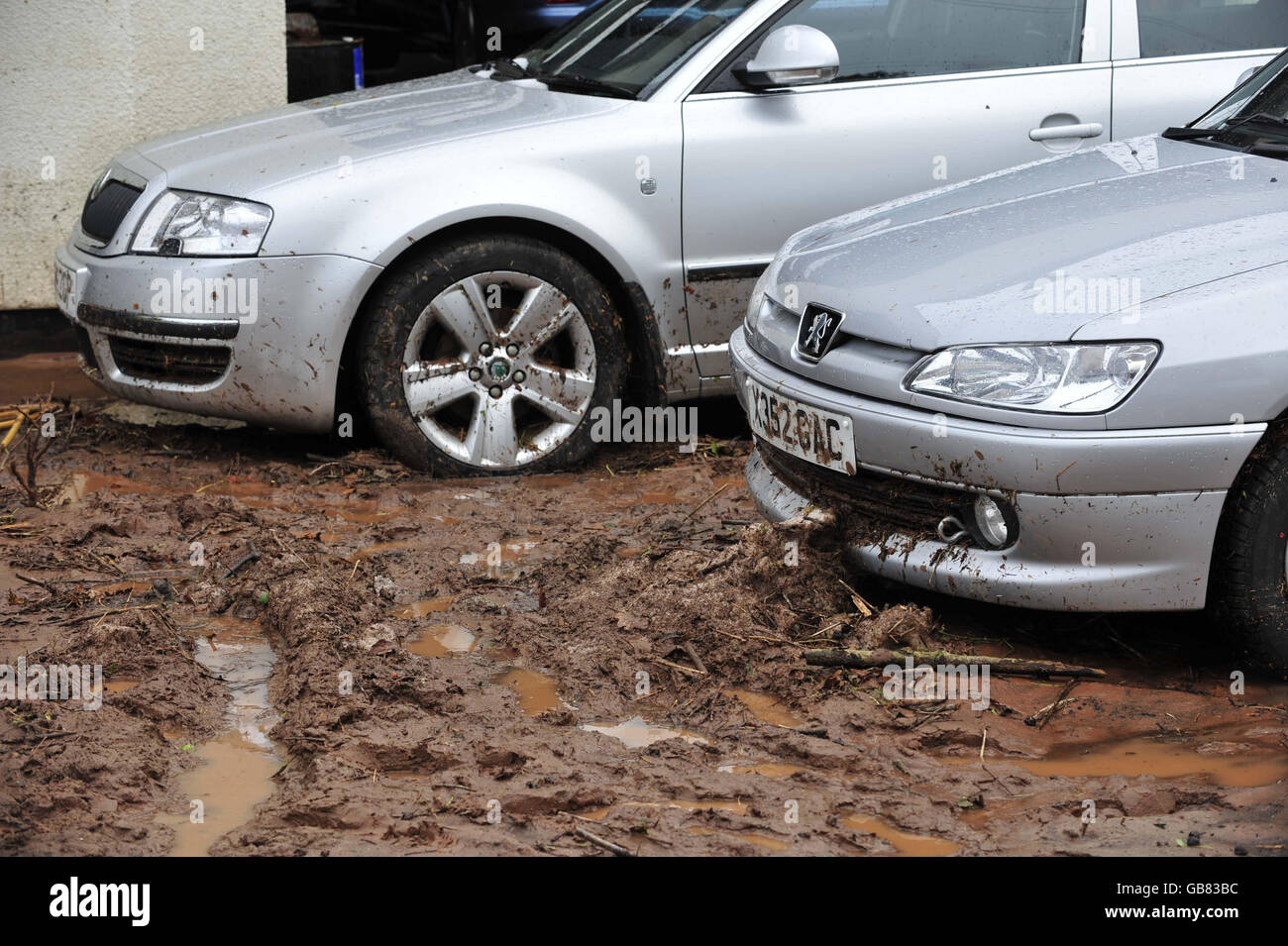 Cars on the forecourt of Ottery Motor Services garage at Coombe Lake Fairmile, Devon, after a freak hail storm. Stock Photo
