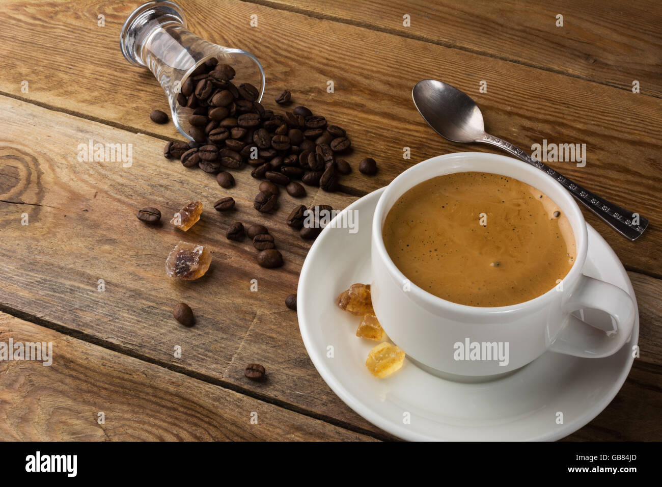 Coffee grains and cup of coffee. Coffee cup. Strong coffee. Coffee mug. Morning coffee. Cup of coffee. Coffee break. Stock Photo