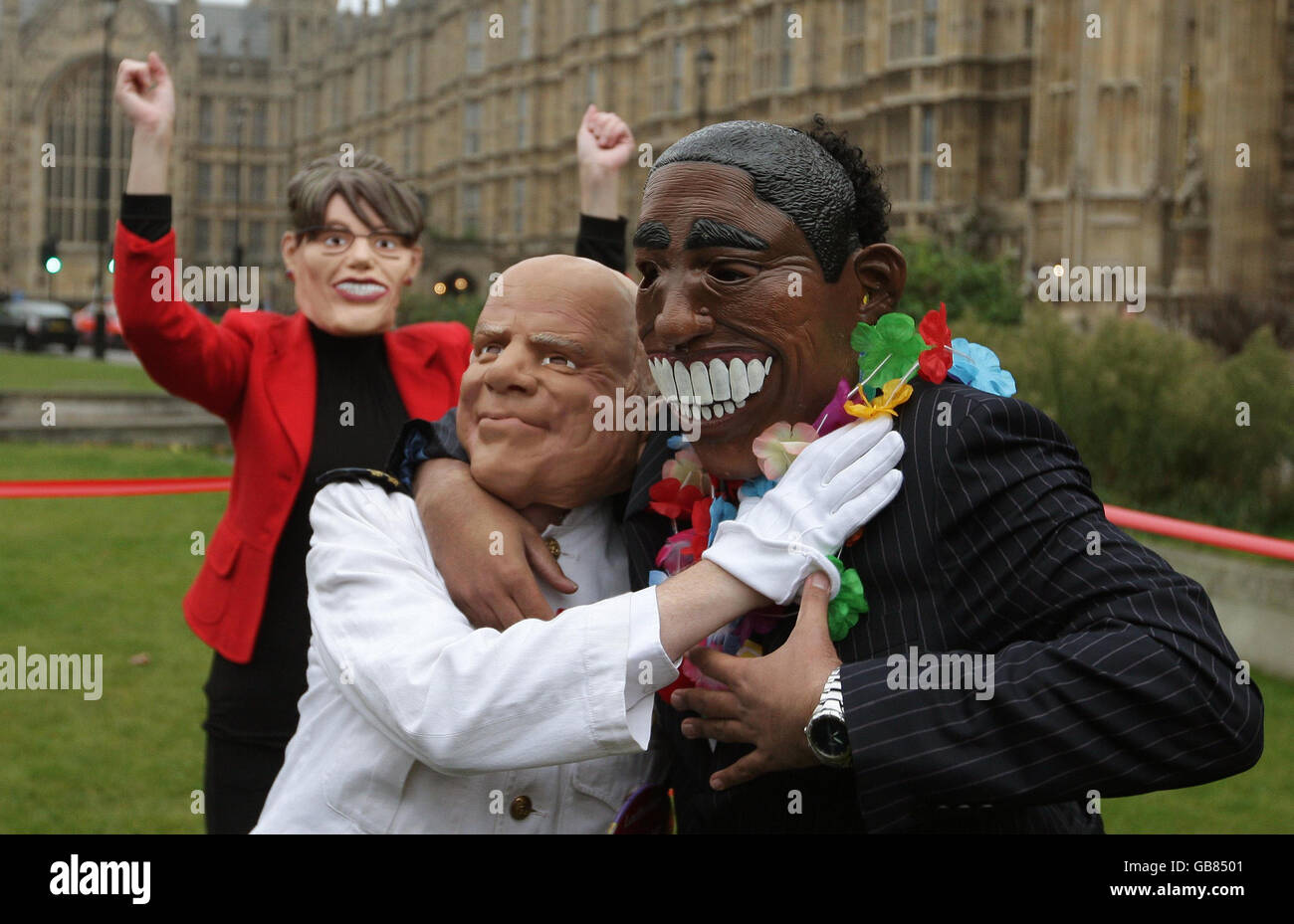 Actors dressed as US Presidential candidates Barack Obama and John McCain, and Vice-Presidential candidate Sarah Palin take part in a wrestling match staged by betting firm Ladbrokes, on College Green, Westminster, London. Stock Photo