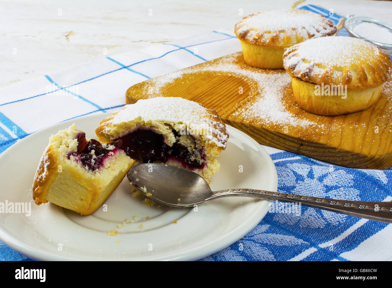 Sweet small pie on the white plate, close up. Sweet dessert. Sweet pastry. Small pie. Pie. Jam pie Stock Photo