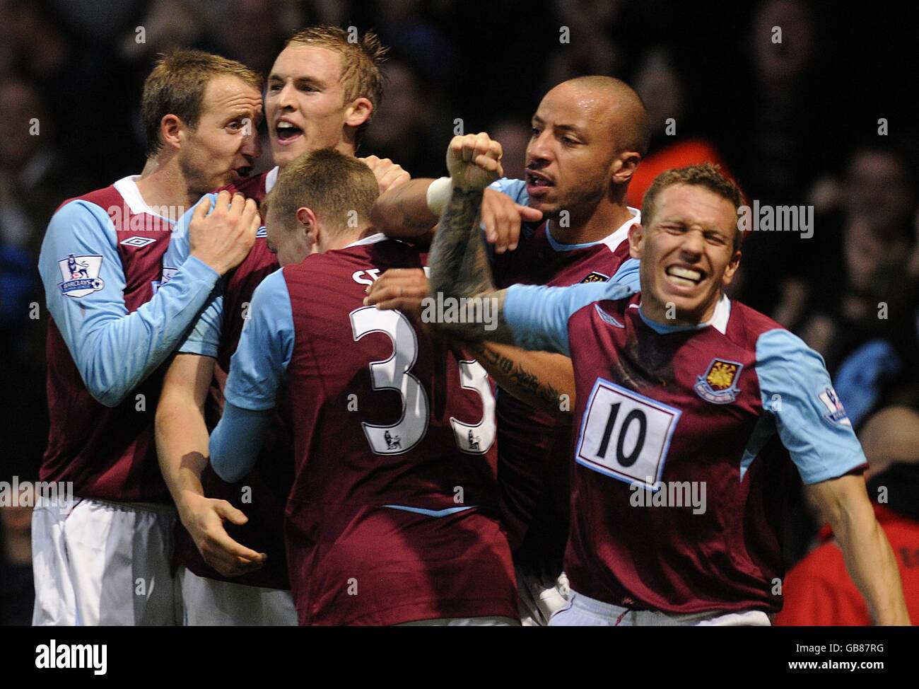 West Ham United's Craig Bellamy punches the air after his team mate Jack Collison (second left) scored the opening goal. Stock Photo