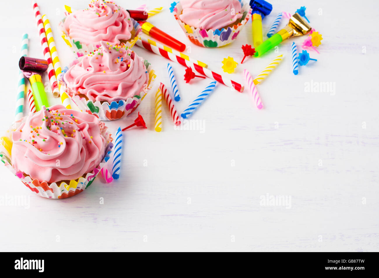 Birthday background with pink cupcakes. Birthday cupcakes. Homemade cupcake. Gourmet cupcakes. Sweet dessert. Sweet pastry. Stock Photo