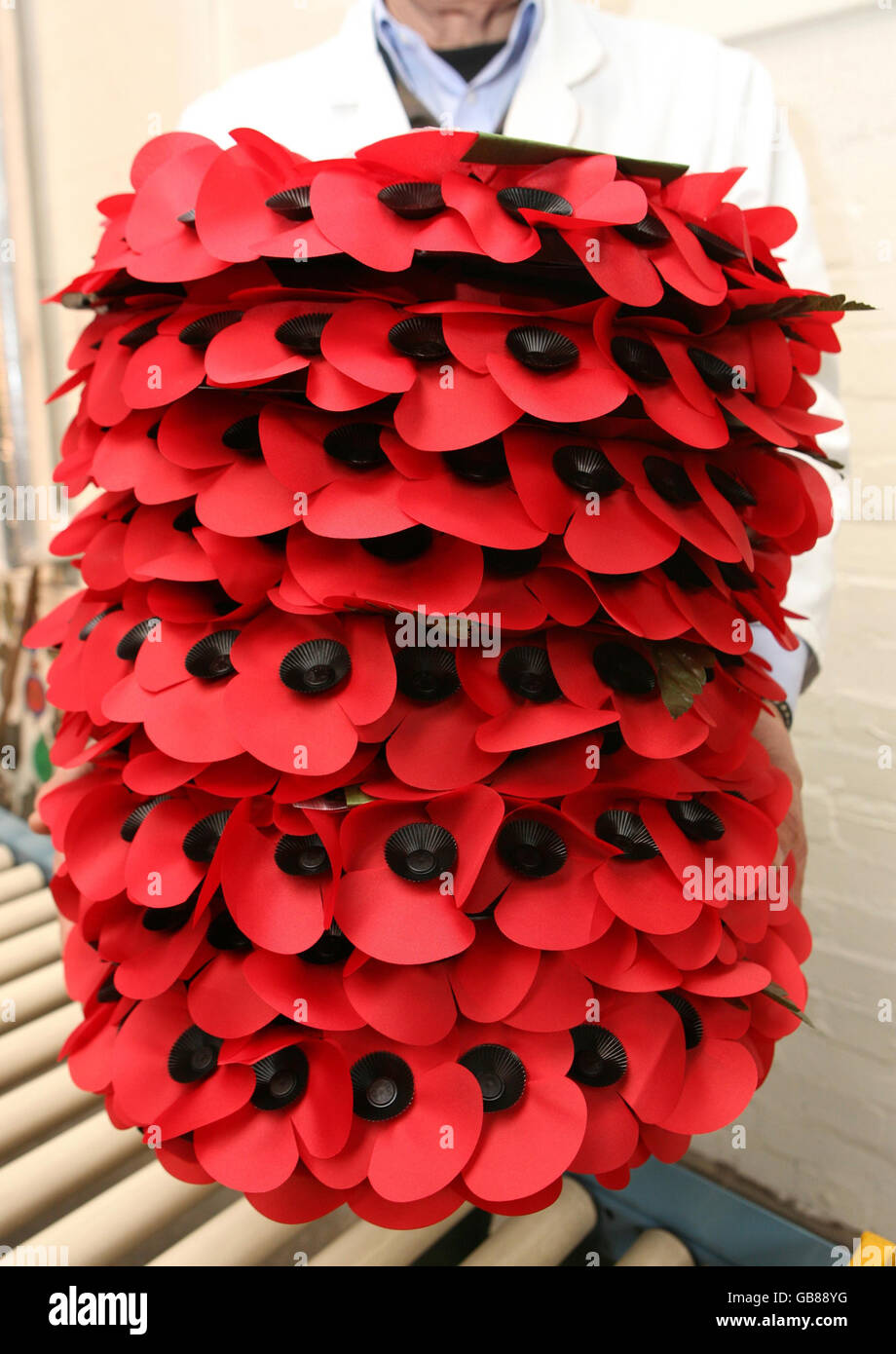 Wreaths of poppies are taken to be boxed up at the Royal British Legion