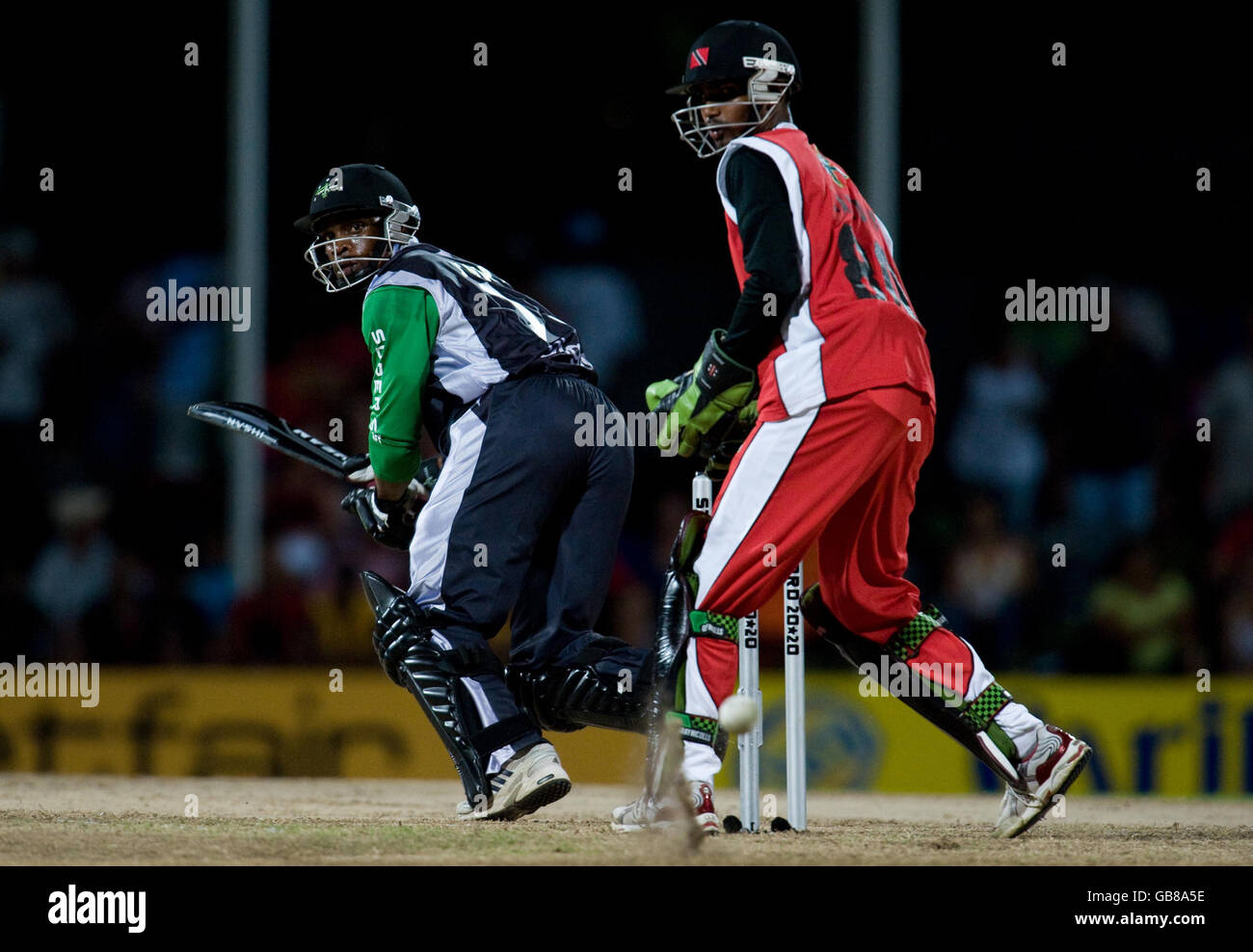 Stanford Superstars' Sylvester Joseph hits past Trinidad and Tobago wicketkeeper Denesh Ramdin during the Stanford Super Series match at Stanford Cricket Ground, Coolidge, Antigua. Stock Photo