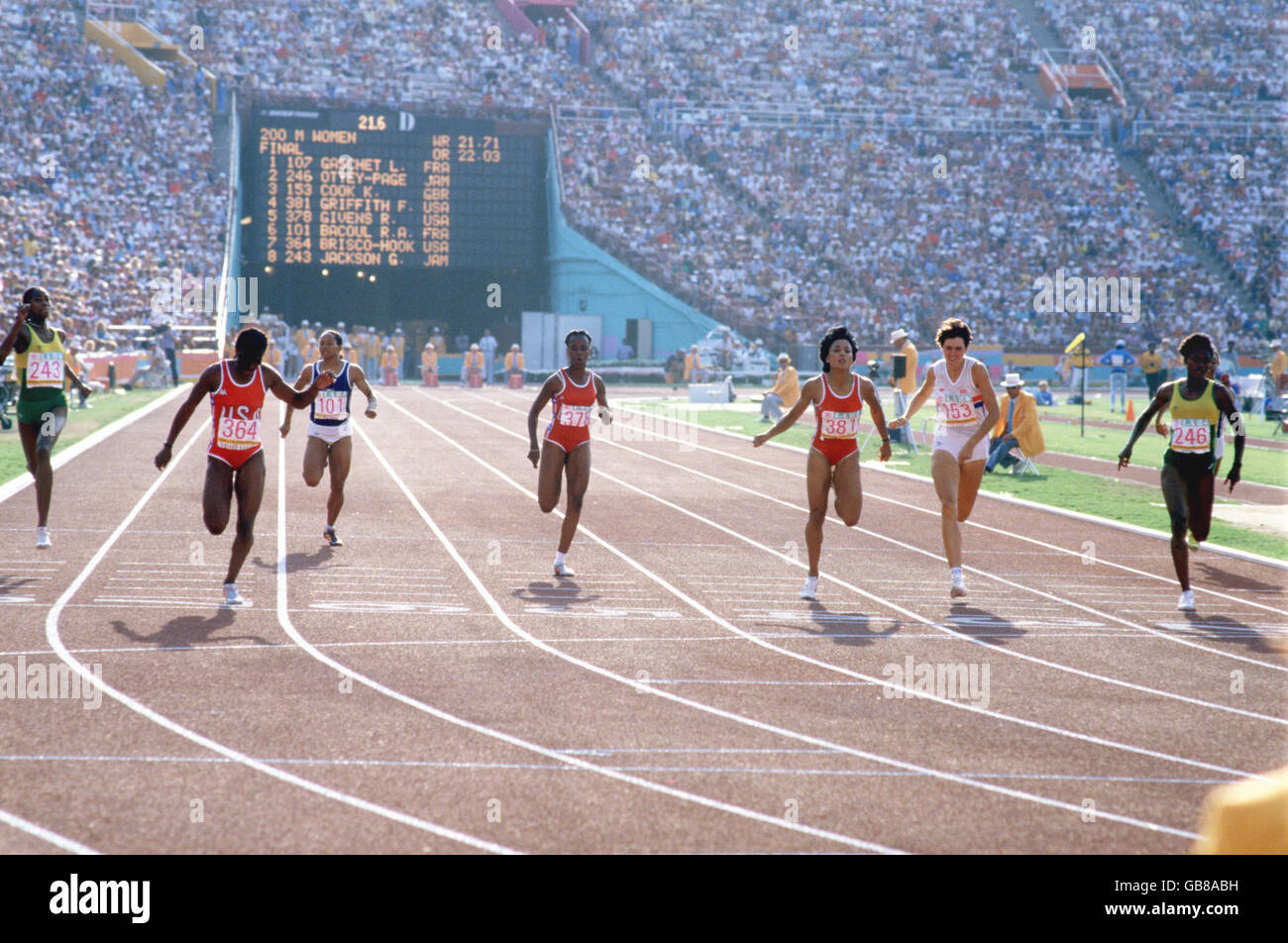 USA's Valerie Brisco-Hooks (second l) wins gold from teammate Florence Griffith (third r, silver), Jamaica's Merlene Ottey (r, bronze), Great Britain's Kathy Cook (second r), Jamaica's Grace Jackson (l), USA's Randy Givens (fourth l), France's Rose-Aimee Bacoul (third l) and France's Liliane Gaschet (r, hidden) Stock Photo