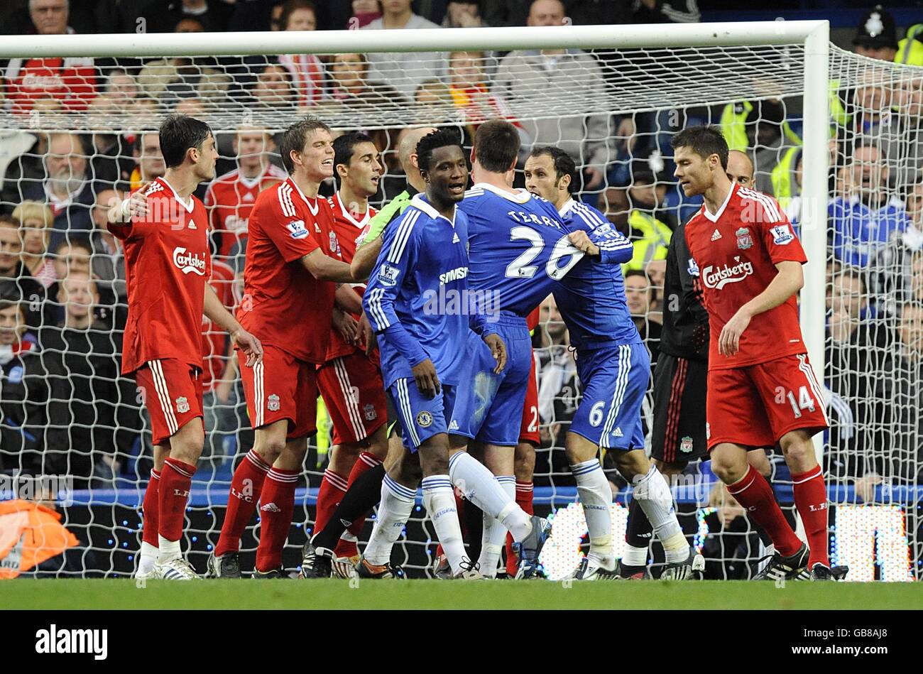 Soccer - Barclays Premier League - Chelsea v Liverpool - Stamford Bridge. Tempers flare in the penalty area after a challenge between Chelsea's John Terry and Liverpool goalkeeper Jose Reina Stock Photo