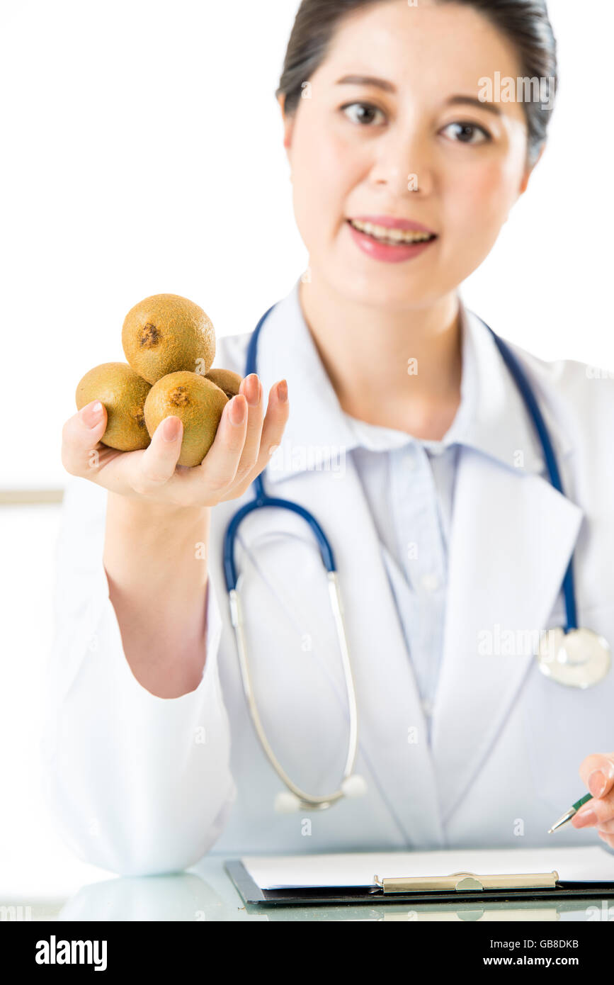Young asian nutritionist doctor writing diet plan, kiwi Stock Photo - Alamy