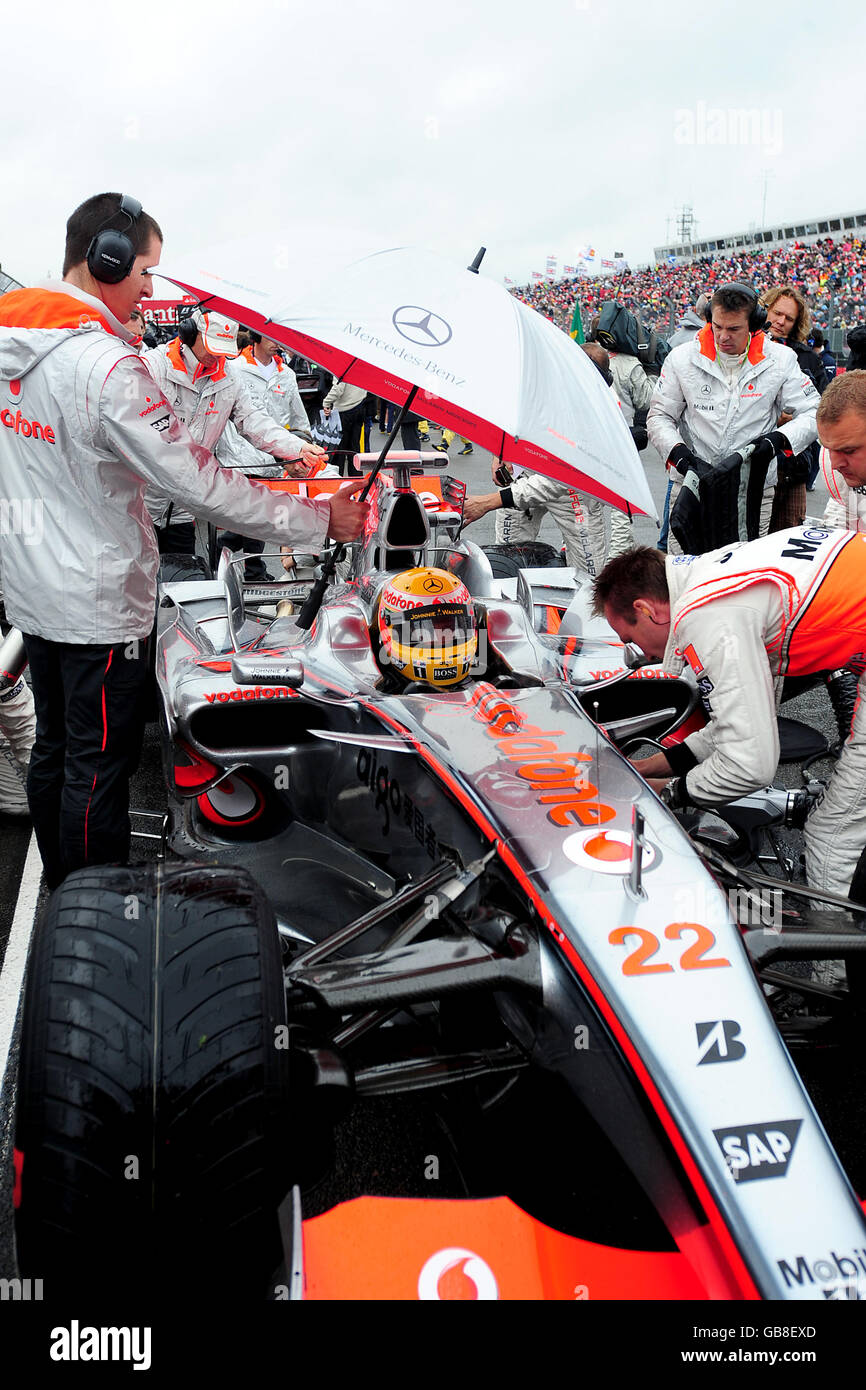 Mclarens lewis hamilton comes into pits hi-res stock photography and ...