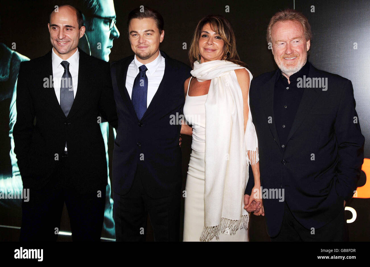 Leonardo DiCaprio, second left, with director Ridley Scott, right and his partner Giannina Facio and British actor, Mark Strong at the UK film premiere of 'Body of Lies' at the Vue West End, in central London. Stock Photo