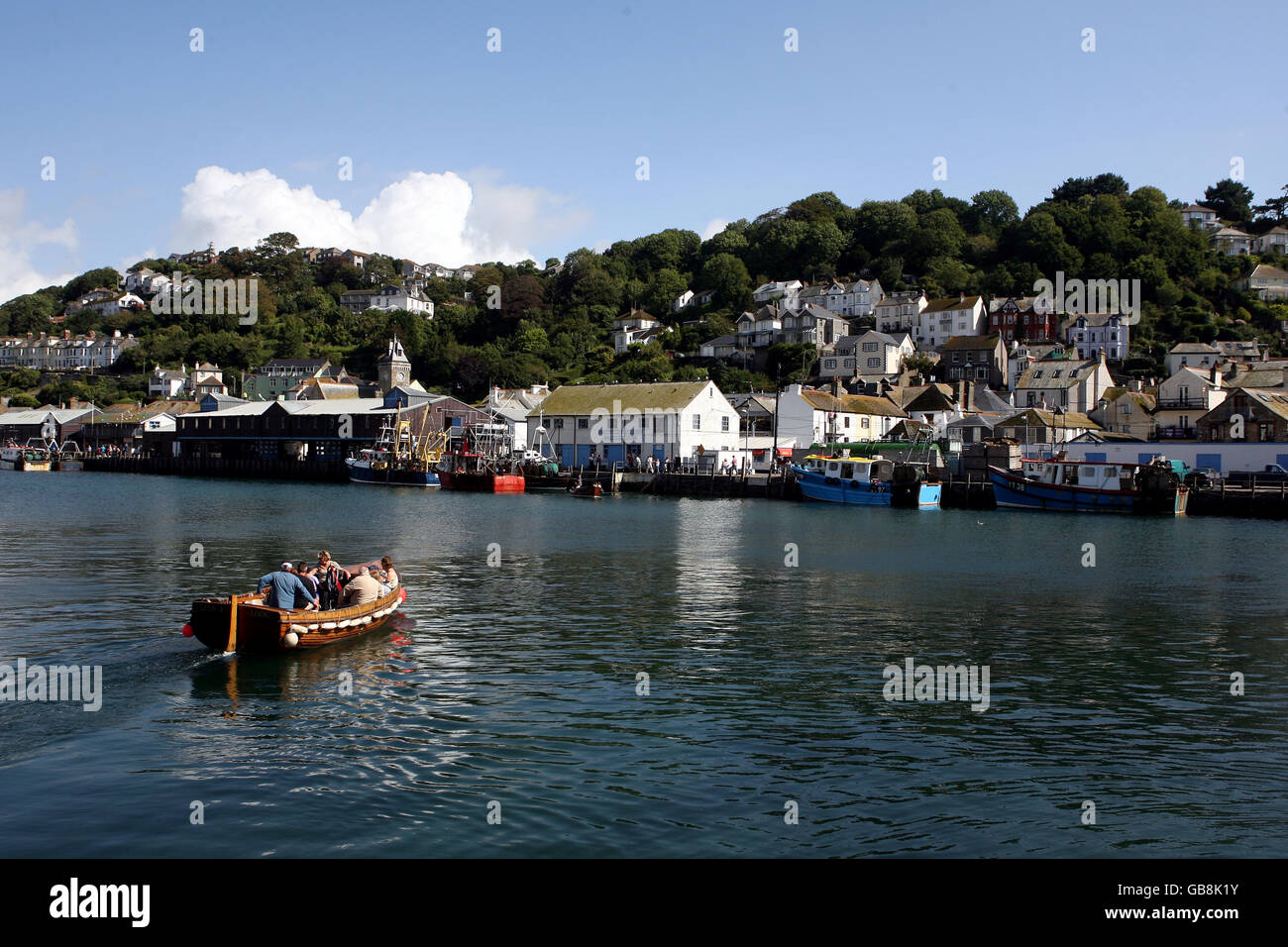A ferry carries passengers accross the river at Looe in Cornwall. Stock Photo