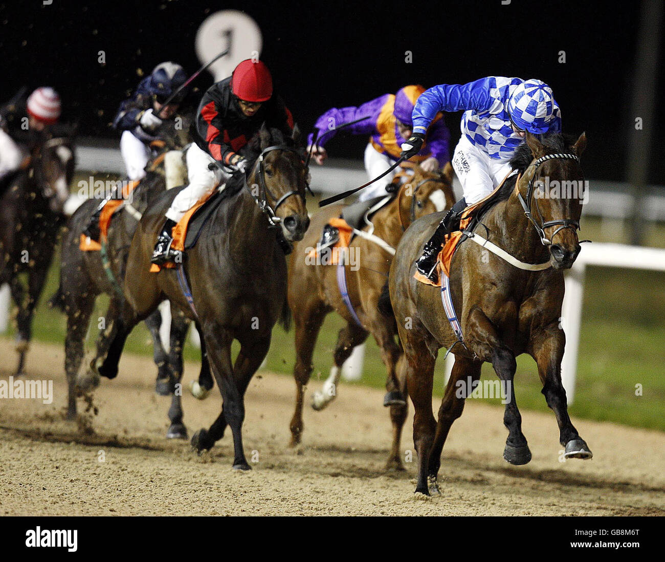 Awatuki and jockey Pat Cosgrave (right) wins the Wivenhoe Handicap at Great Leighs Racecourse, Chelmsford. Stock Photo