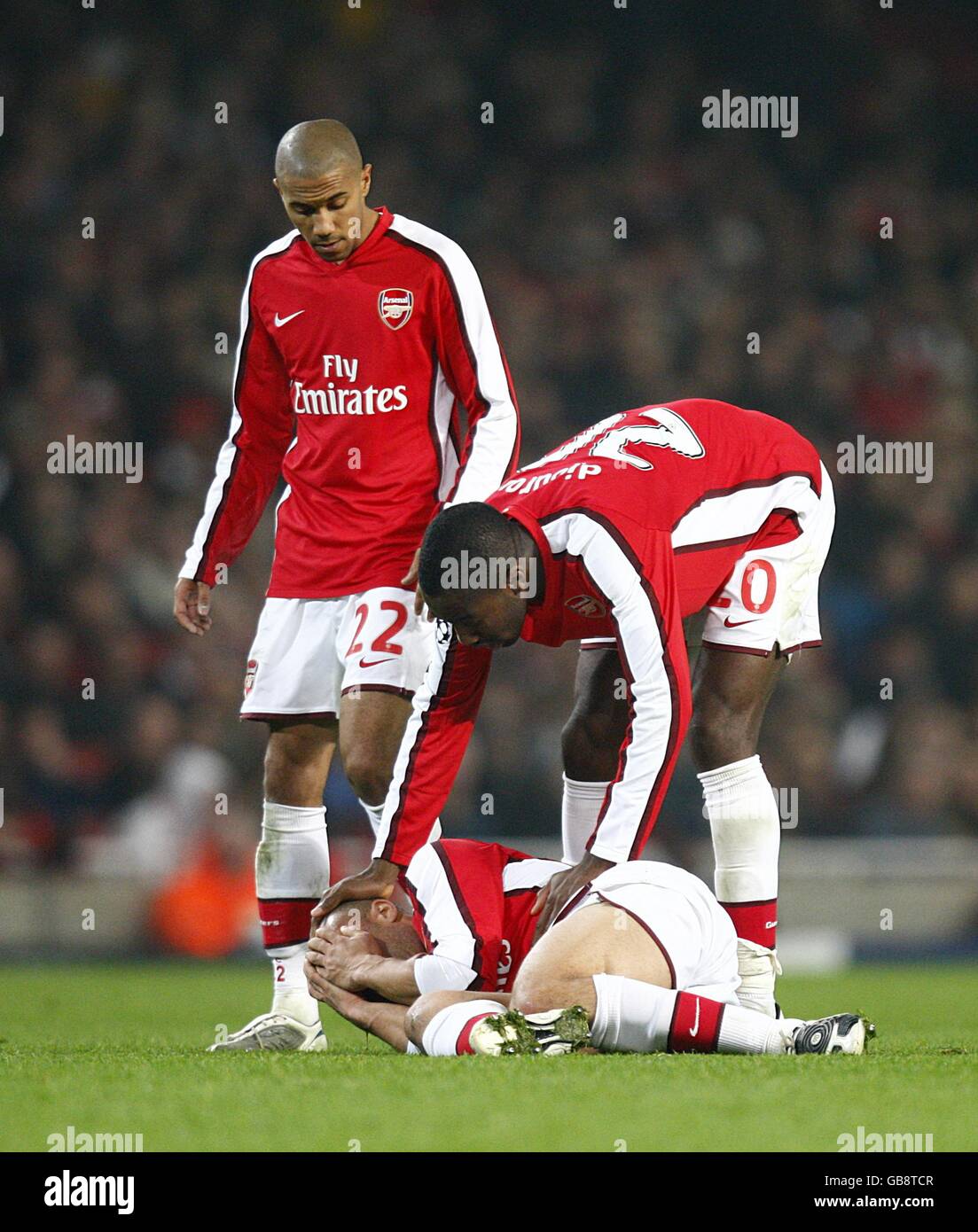 Arsenal's Mikael Silvestre lies on the ground in pain with a injury to his nose Stock Photo