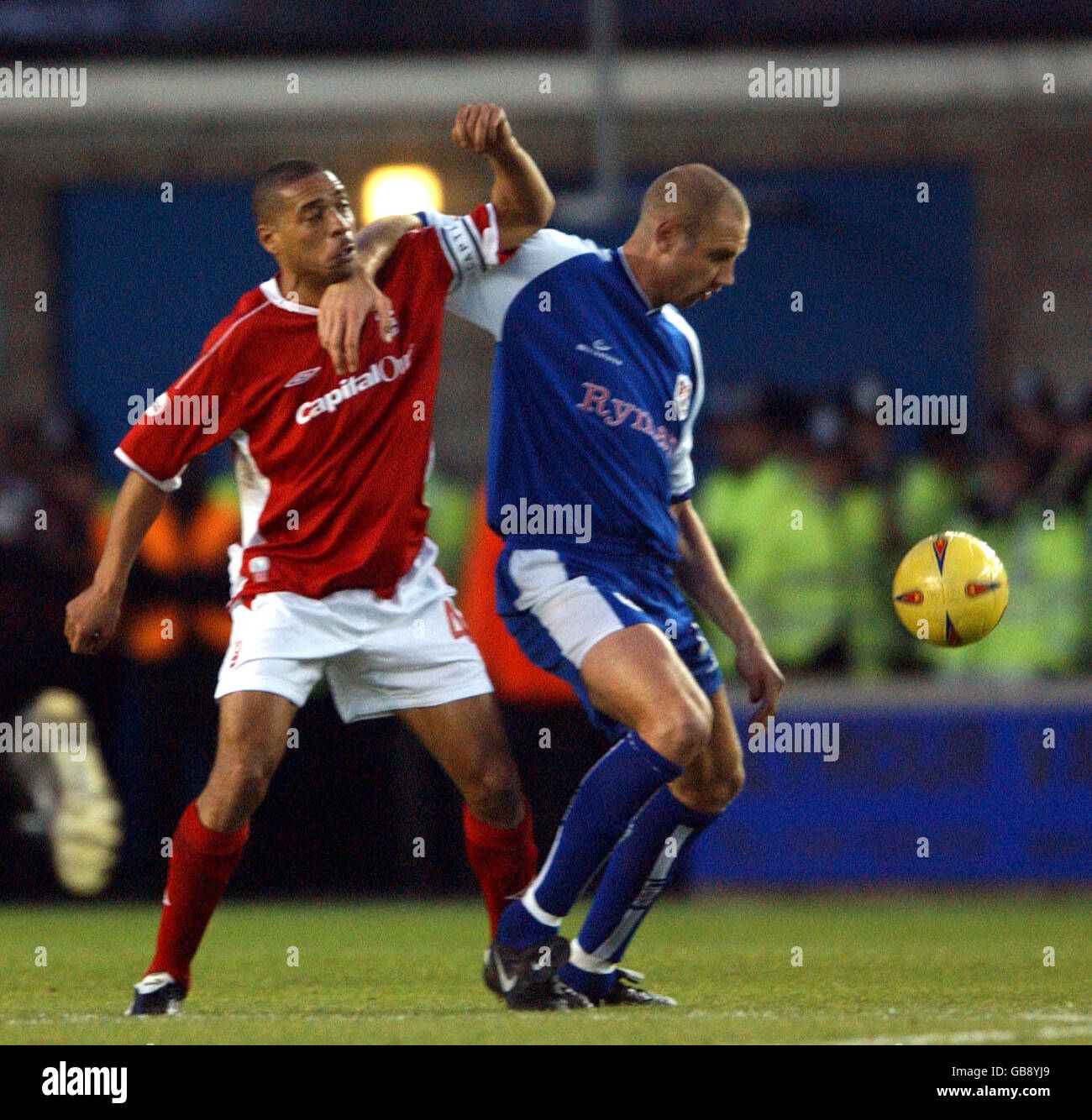 l-r; Nottingham Forest's Des Walker battles for possession of the ball with Millwall's Bob Peeters Stock Photo
