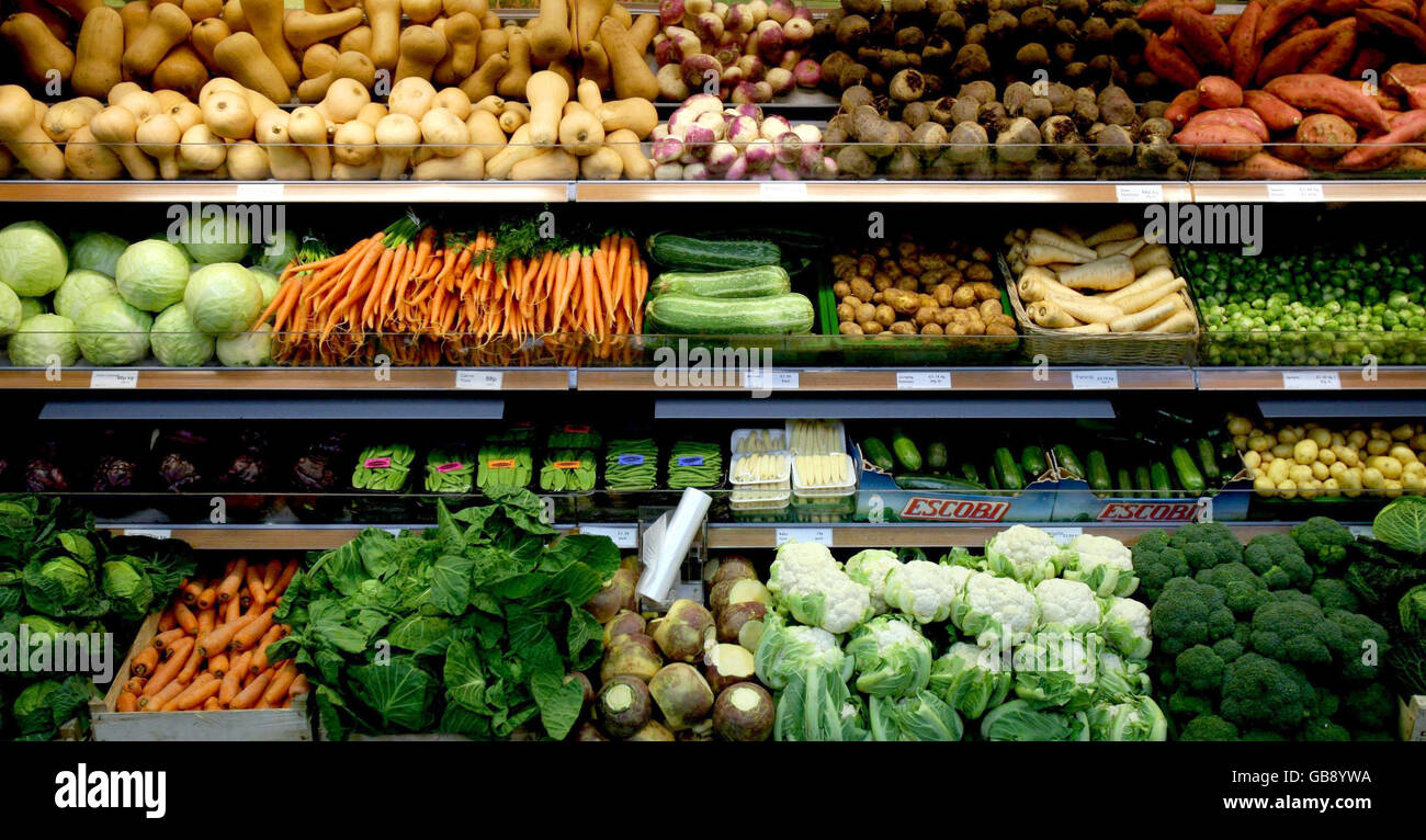 Vegetables on display at Coton Farm Shop in Cambridgeshire. Curvy cucumbers and nobbly carrots will be back on sale in the shops from next July if, as expected, more than two dozen laws banning imperfect-looking fruit and veg are scrapped today. Stock Photo