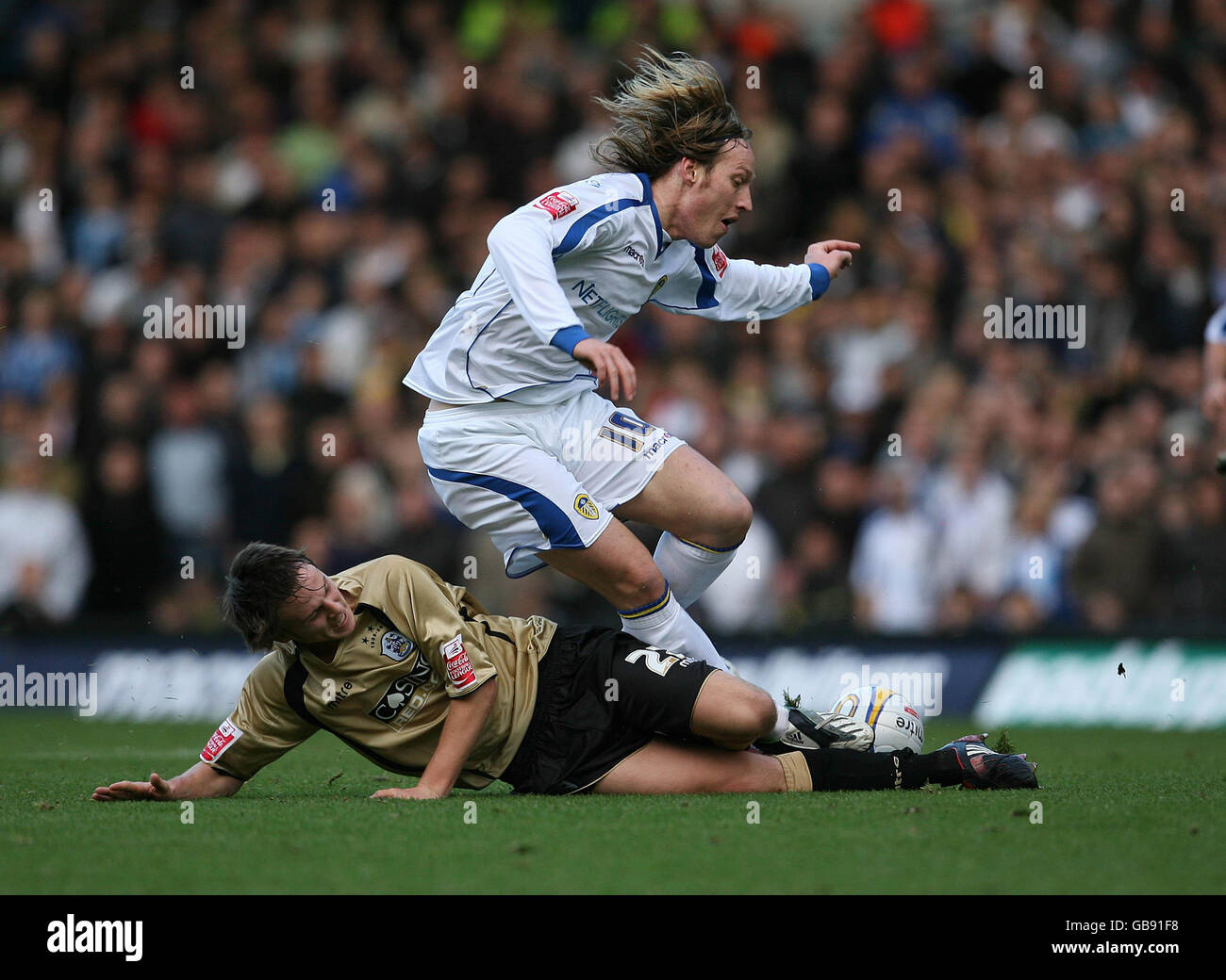 Leeds United's Luciano Becchio and Huddersfield Town's James Berrett (left) during the Coca-Cola Football League One match at Elland Road, Leeds. Stock Photo
