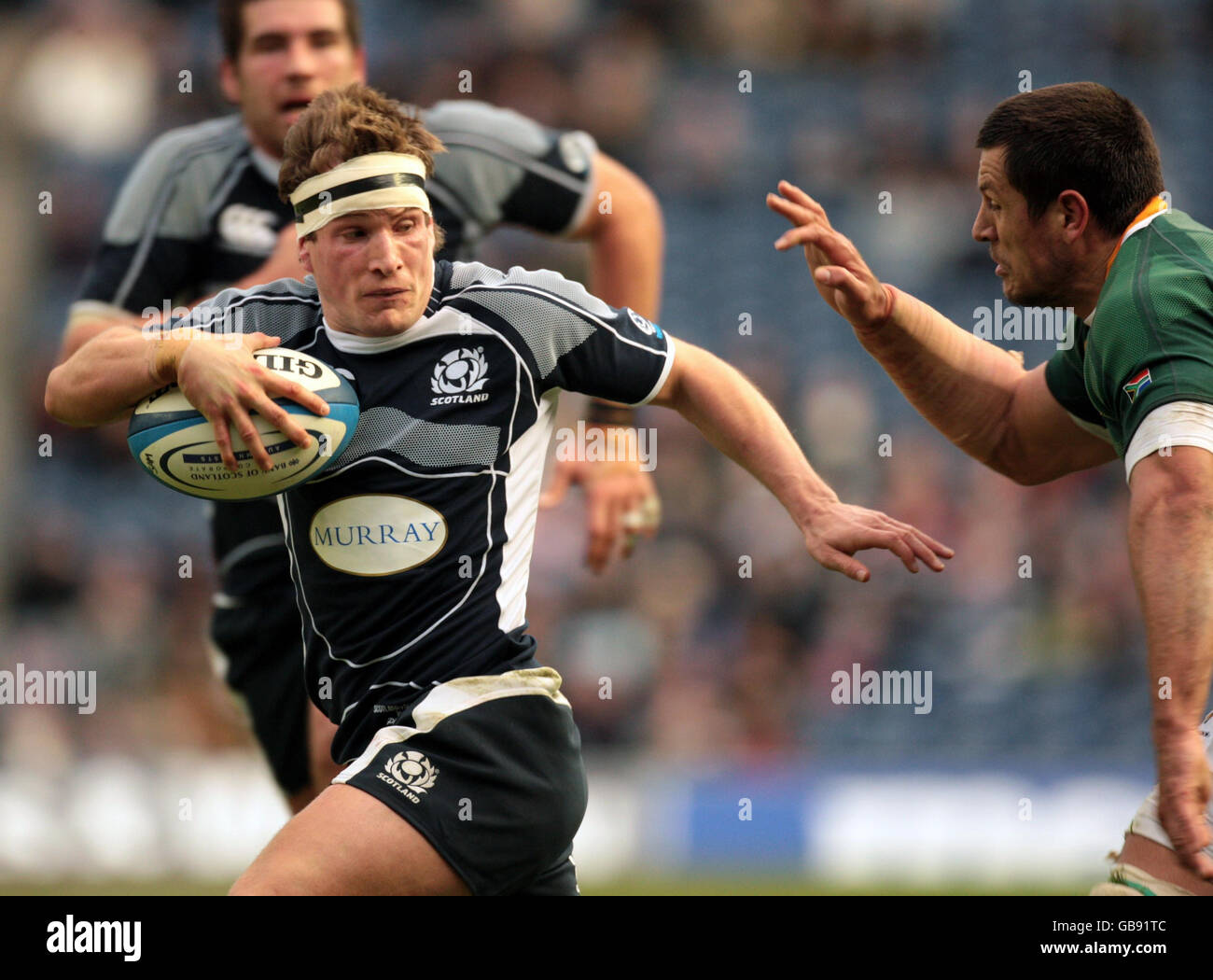 Rugby Union - 2008 Bank Of Scotland Corporate Autumn Test - Scotland v South Africa - Murrayfield. Scotland's Phil Godman holds off the South Africa defence during the International match at Murrayfield, Edinburgh. Stock Photo
