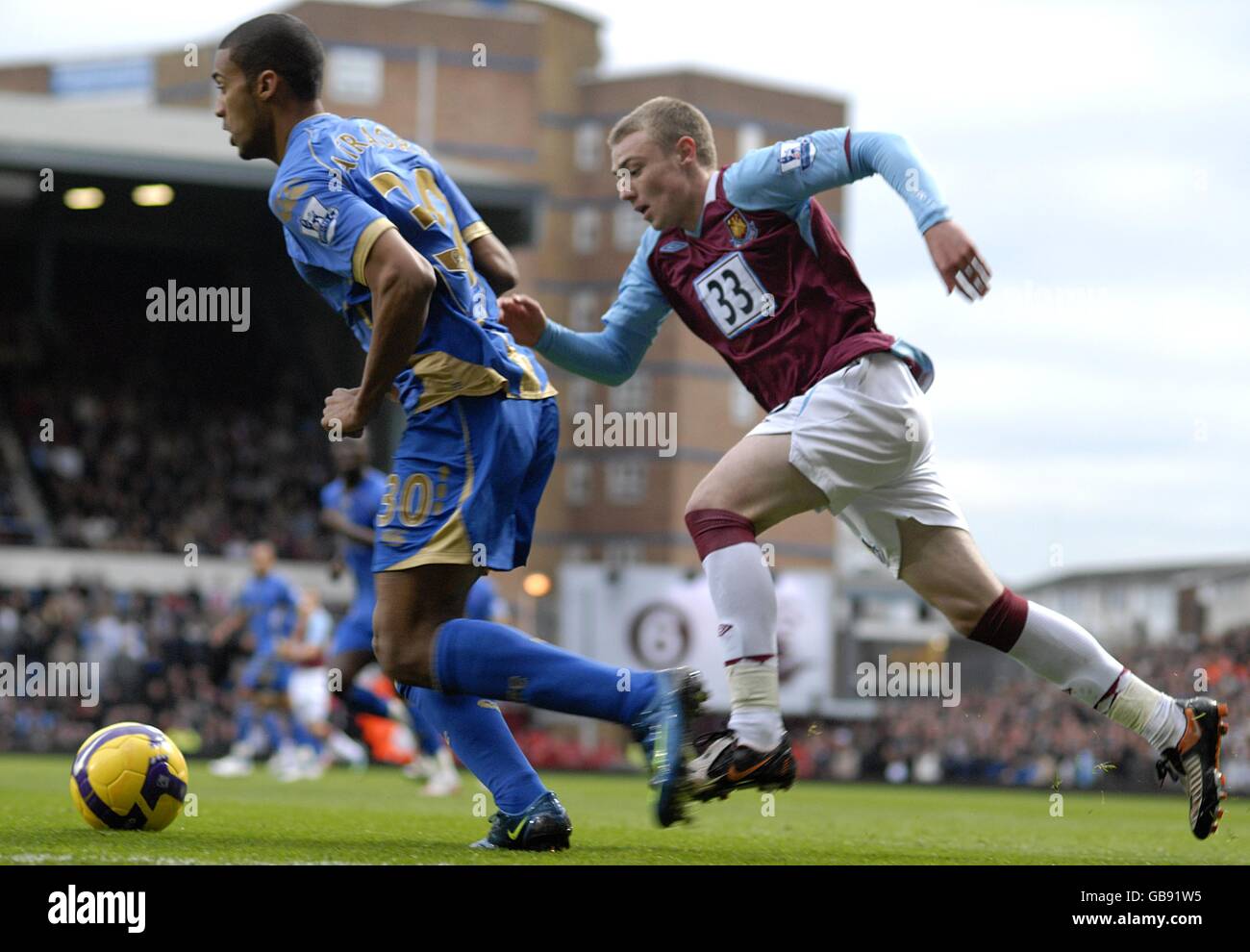 Soccer - Barclays Premier League - West Ham United v Portsmouth - Upton Park. Portsmouth's Armand Traore and West Ham United's Fred Sears (right) battle for the ball Stock Photo