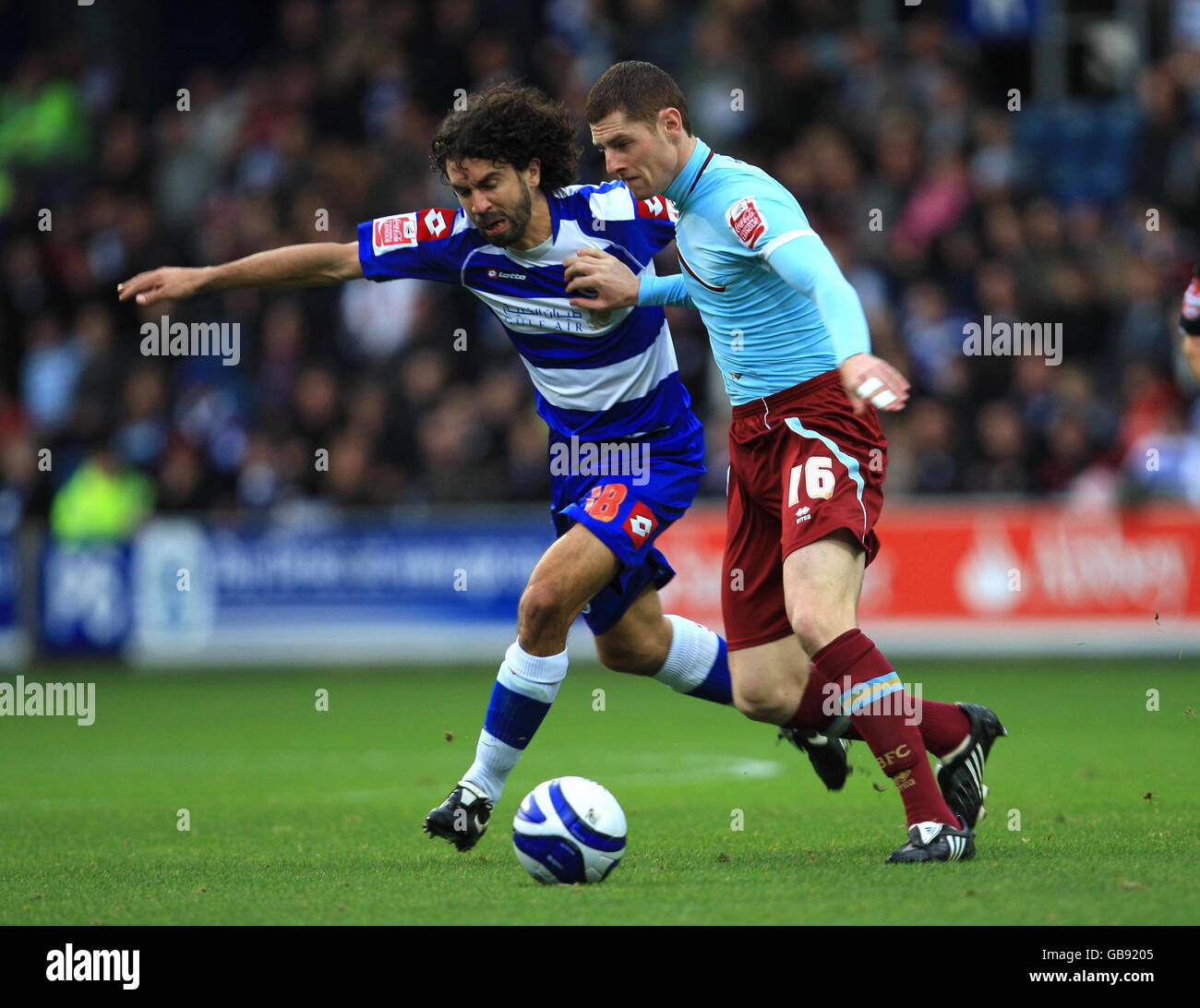 Queens Park Rangers' Damiano Tommasi and Burnley's Chris McCann battle for the ball during the Coca-Cola Football Championship match at Loftus Road, London. Stock Photo