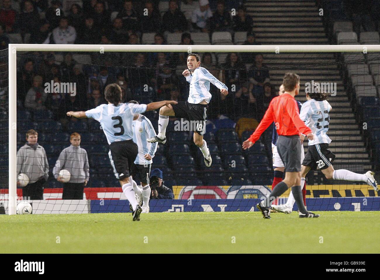 Argentina's Maximiliano Rodriguez (in air) celebrates scoring his sides first goal of the game Stock Photo