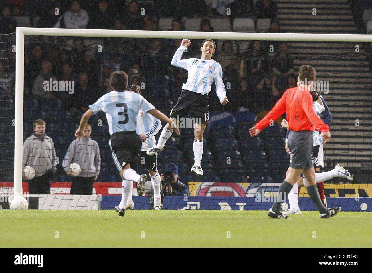 Argentina's Maximiliano Rodriguez (in air) celebrates scoring his sides first goal of the game Stock Photo