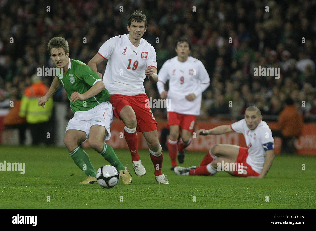 Republic of Ireland's Kevin Doyle out runs three Polish defenders during the International Friendly at Croke Park, Dublin, Ireland. Stock Photo