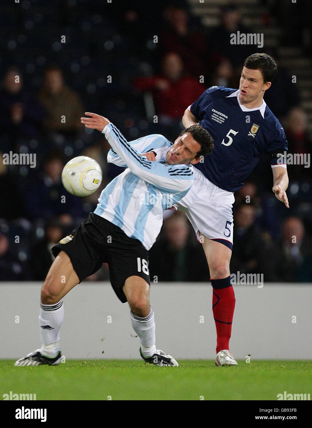 Soccer - International Friendly - Scotland v Argentina - Hampden Park. Argentina's Maximiliano Rodriguez is challenged by Scotland's Gary Caldwell Stock Photo