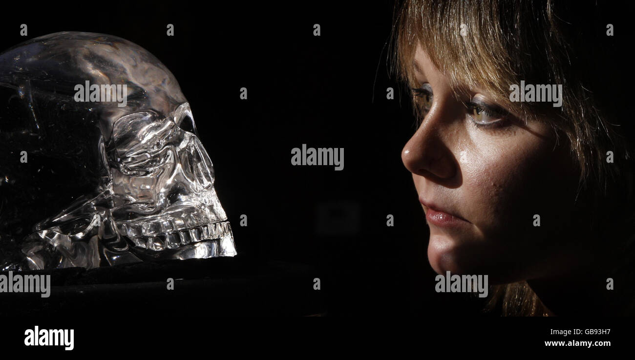 A woman views The Skull of Doom, on display at the Histories and Mysteries conference in the Hub in Edinburgh. Stock Photo