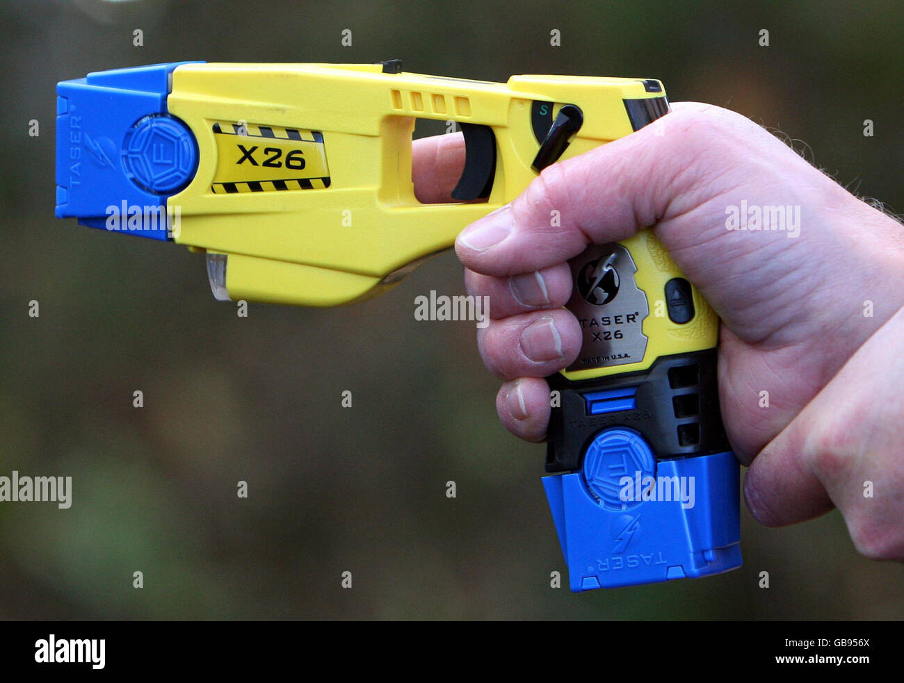 Taser gun hires stock photography and images Alamy