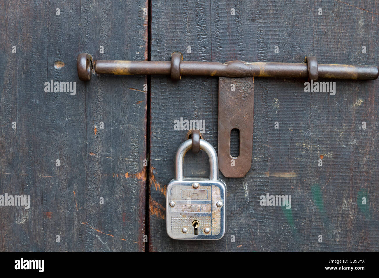 Padlock on the wooden door of Nepal with vintage look Stock Photo Alamy