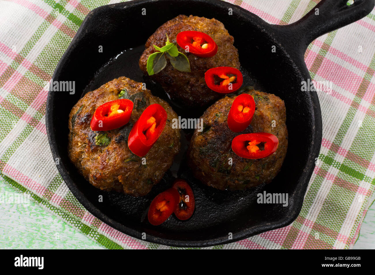 Grilled meatballs with chili pepper slices. Meatloaf. Meatballs.Grilled meatballs. Stock Photo