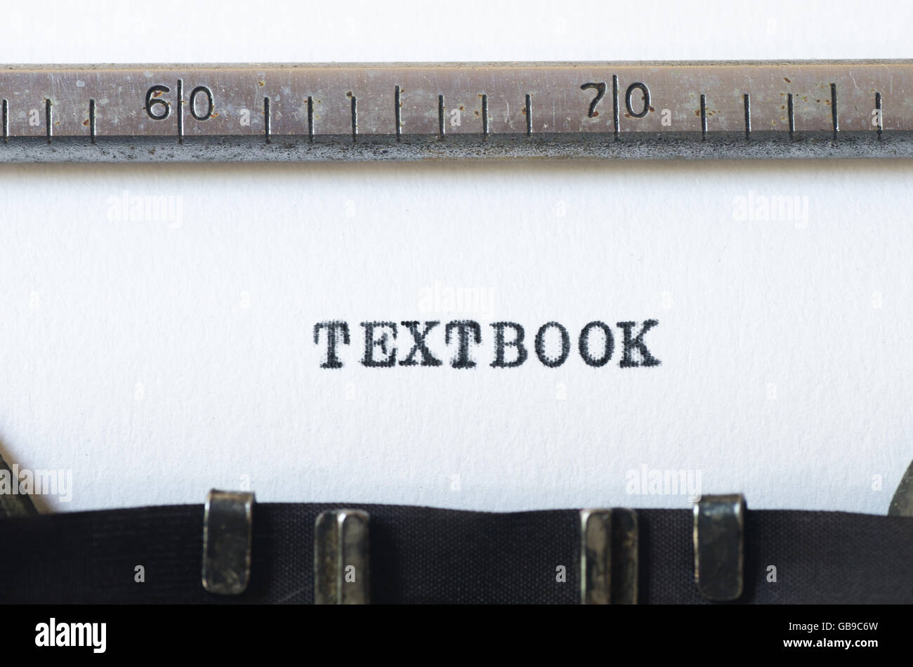 word textbook  typed on old typewriter Stock Photo