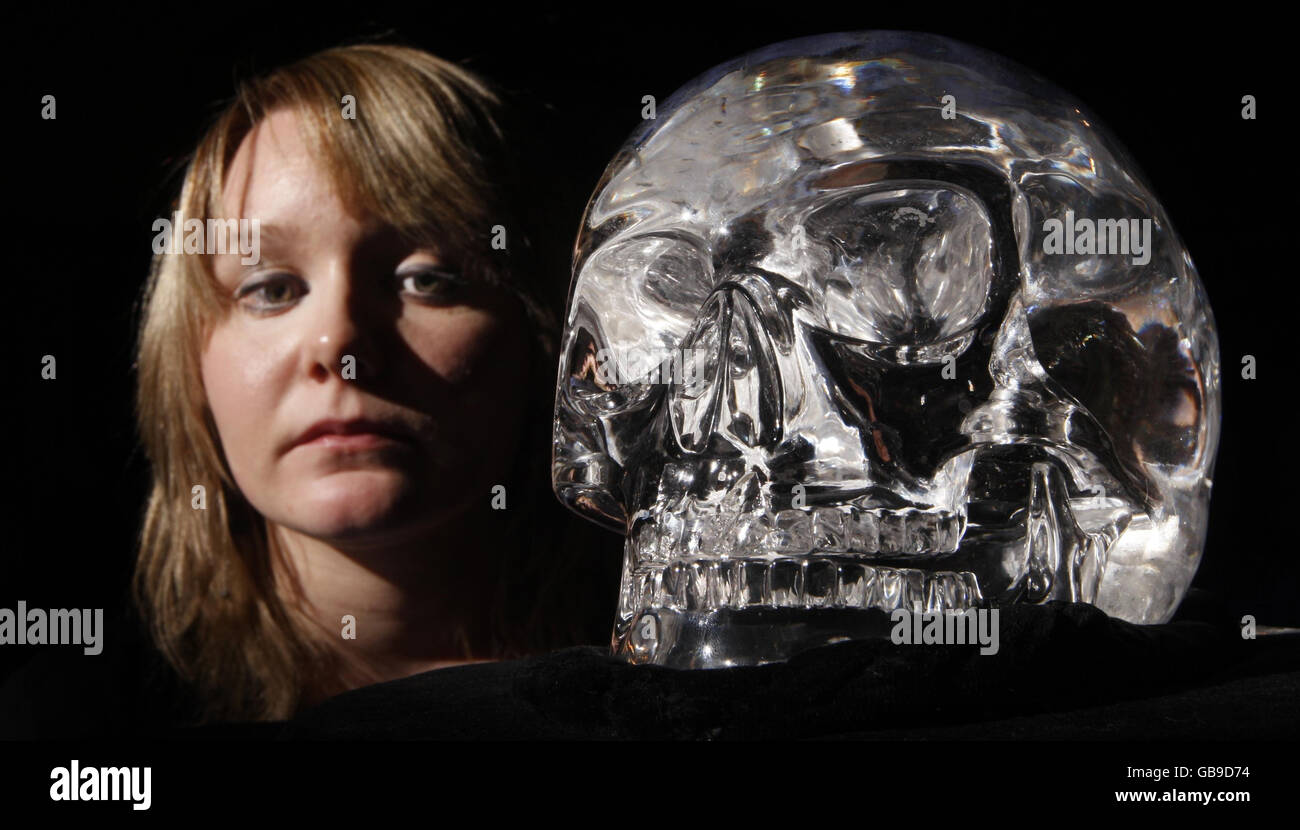 A woman views The Skull of Doom, on display at the Histories and Mysteries conference in the Hub in Edinburgh. Stock Photo