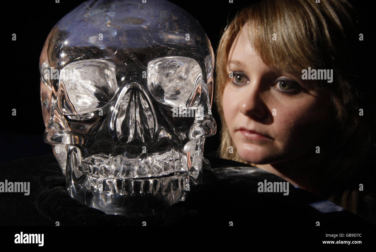 A woman views The Skull of Doom, on display at the Histories and Mysteries conference in the Hub in Edinburgh. Stock Photo