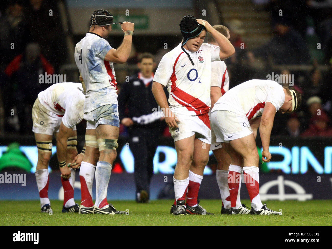 England's Steve Borthwick (left) Matt Stevens (centre) and Dylan Hartley are left dejected following the final whistle at during the Investec Challenge Series match at the Twickenham, London. Stock Photo